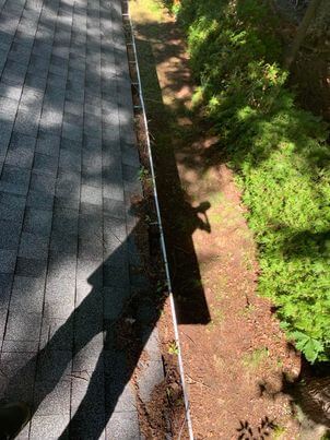 Before cleaning in Beloeil: downspout restricted by internal debris