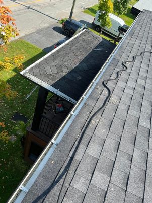 After service: gutter system cleaned and flowing correctly in Boucherville