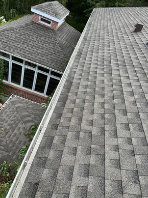 After service: clean and functional gutter with preserved heritage details in Saint-Lambert